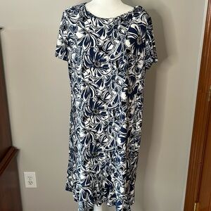 Blue and white round neck, cap sleeve dress with cute ruffle at bottom.